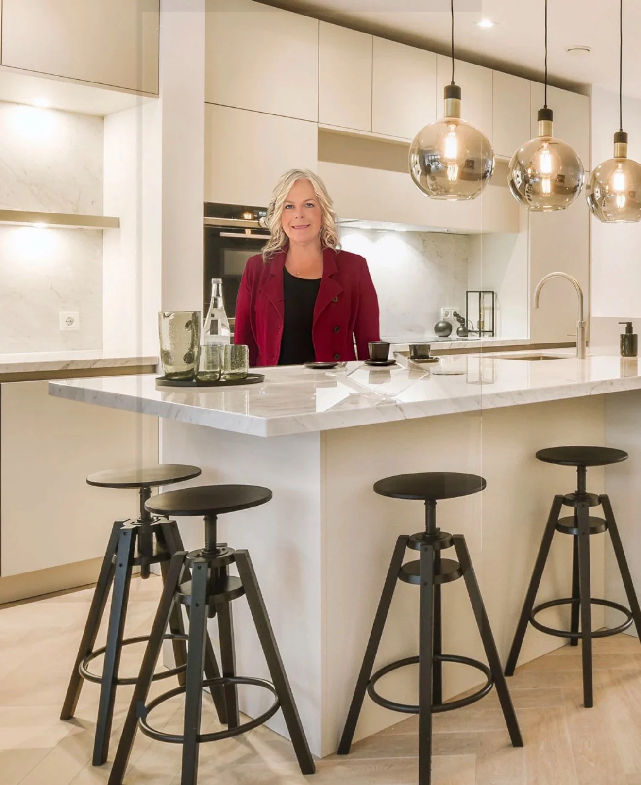 Nicole Toma in a beautifully designed kitchen